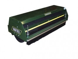 Green lawn dethatcher attachment designed for efficient thatch removal, promoting healthy grass growth. Ideal for lawn care and maintenance.