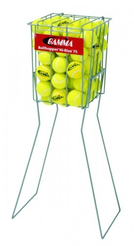Tennis ball hopper filled with bright yellow tennis balls, elevated on legs for easy access during practice or training sessions.