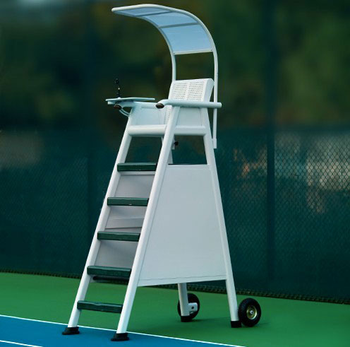 A white tennis umpire chair with a canopy, positioned on a green court, providing a vantage point for officiating matches.