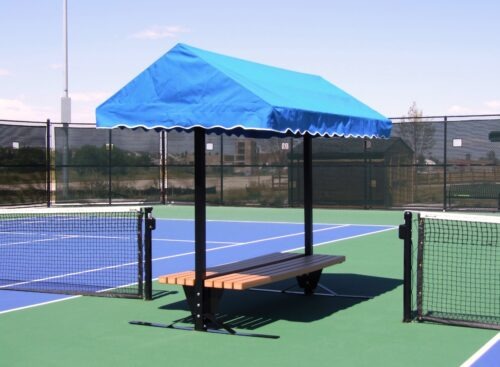 Blue canopy shelter with a bench on a tennis court, providing shade and rest for players during matches or training.