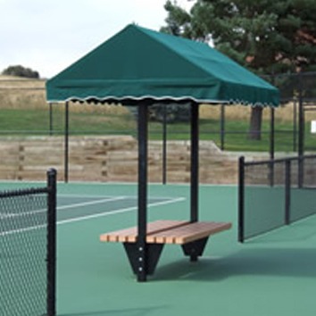 Green canopy-covered bench on a tennis court provides shade and seating for players during match breaks. Ideal for outdoor sports settings.